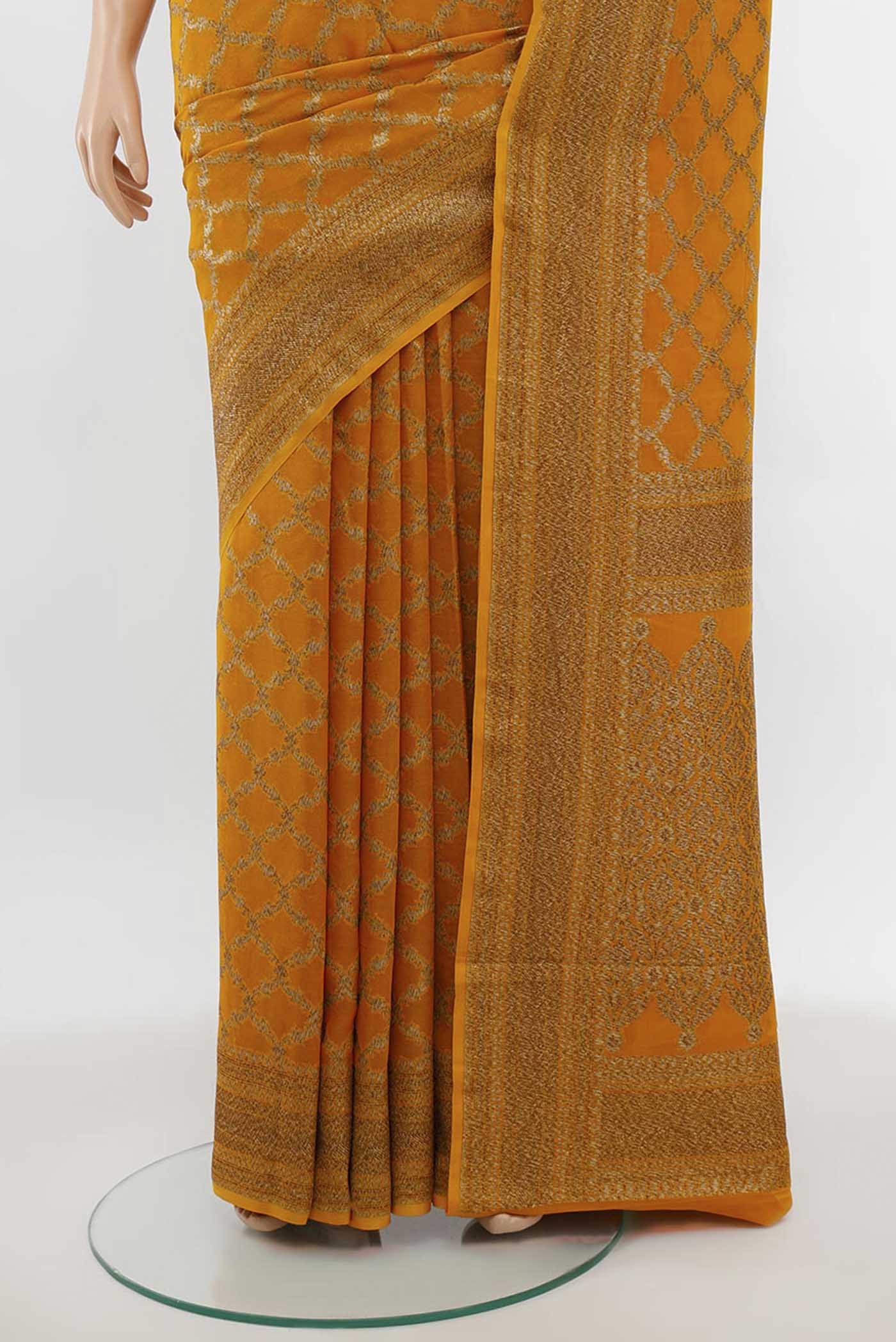 Pleats and pallu of Mustard Banarasi Georgette Saree with Zari Butta on the body and Silk Border. 