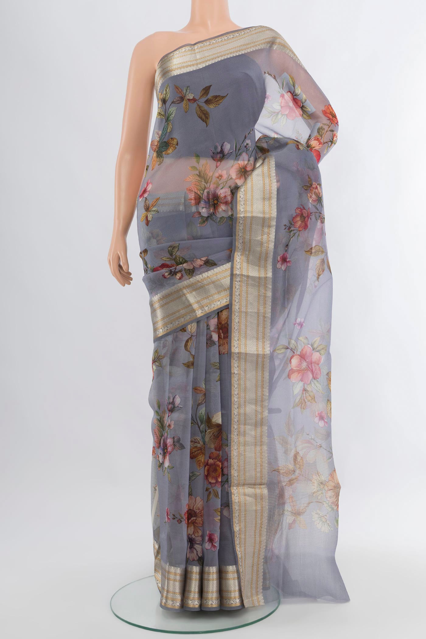 Davys Grey Organza Silk Saree with Floral Print on the body and Zari Border.  displayed on a mannequin