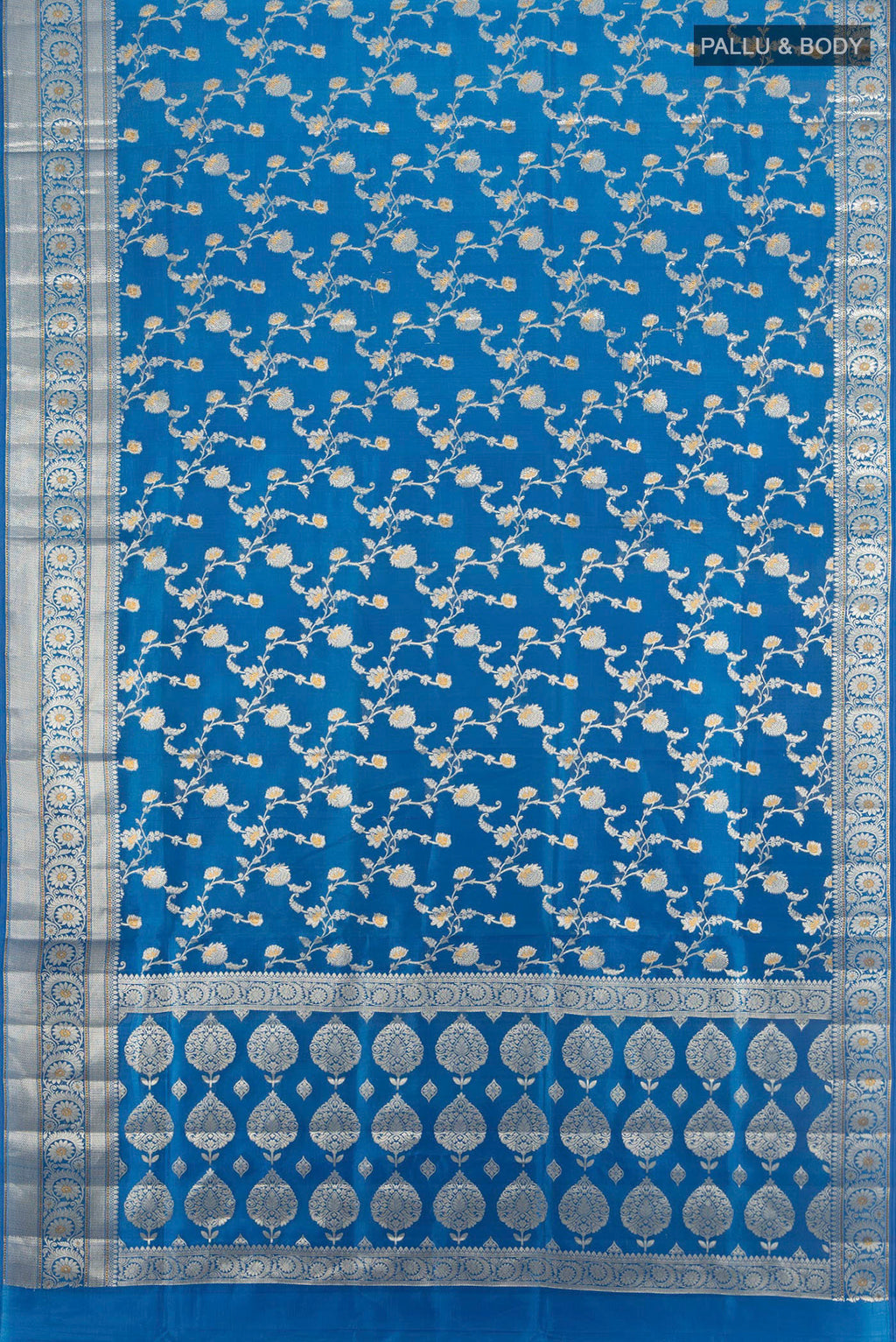 Flat view of Electric Blue Banarasi Raw Silk Saree with Zari Butta on the body and Zari Border. 