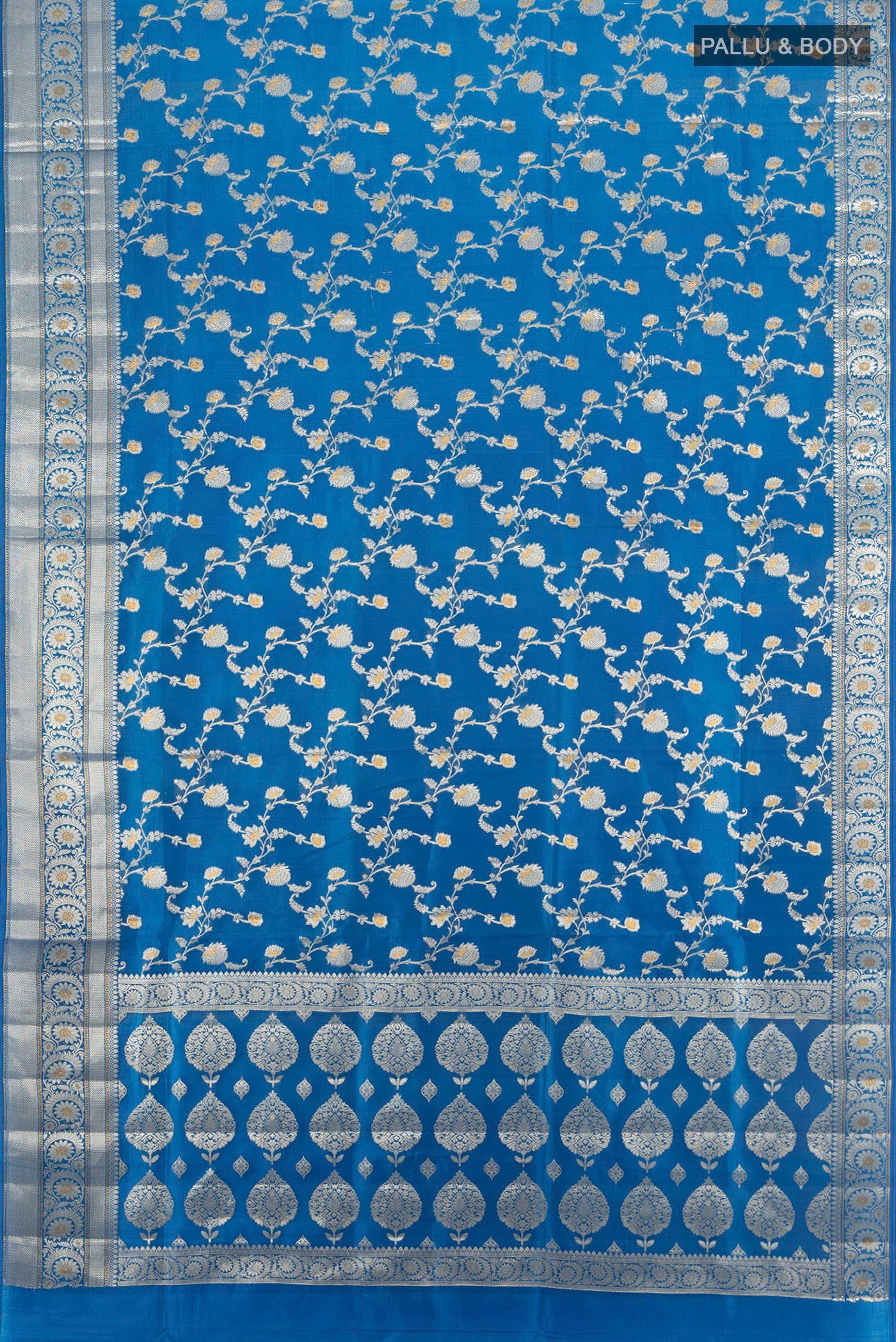 Flat view of Electric Blue Banarasi Raw Silk Saree with Zari Butta on the body and Zari Border. 