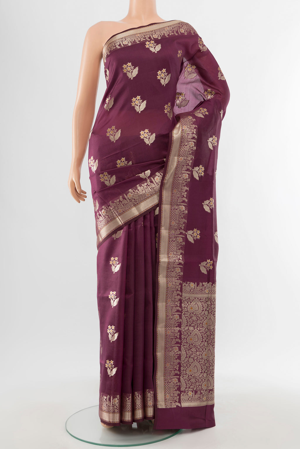Pure Silk Pure Zari Teal Banarasi Raw Saree with Zari Butta on the body and Silk Border.  displayed on a mannequin