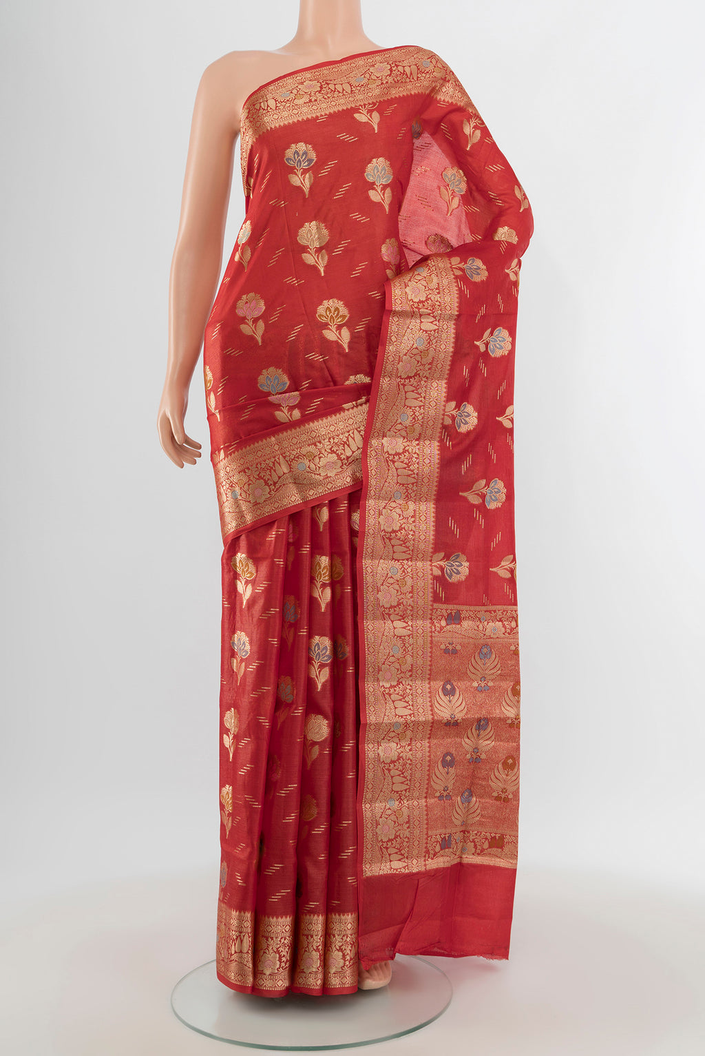 Rust Banarasi Raw Silk Saree with Zari And Thread Butta on the body and Zari Border.  displayed on a mannequin