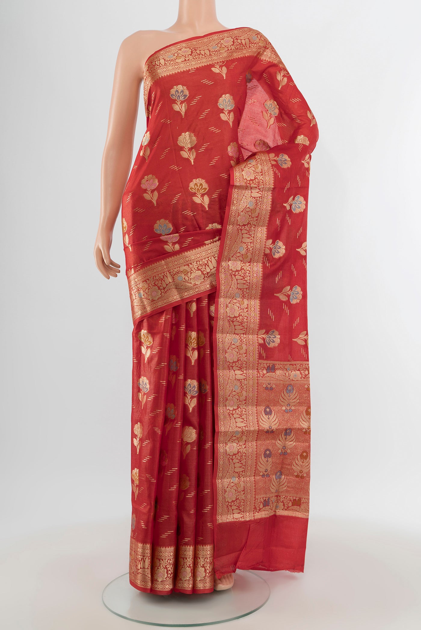 Rust Banarasi Raw Silk Saree with Zari And Thread Butta on the body and Zari Border.  displayed on a mannequin