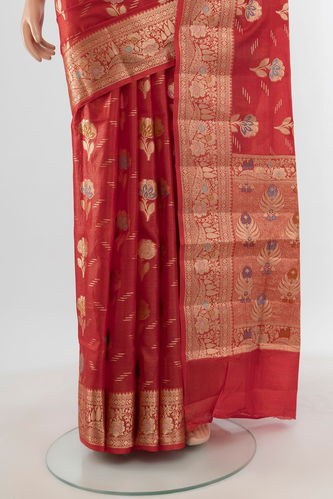 Pleats and pallu of Rust Banarasi Raw Silk Saree with Zari And Thread Butta on the body and Zari Border. 