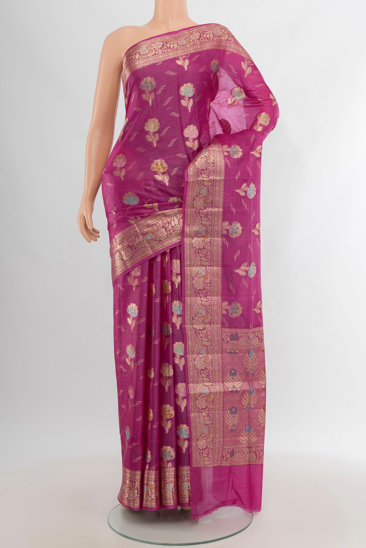 Magenta Banarasi Tussar Silk Saree with Zari Butta on the body and Zari Border.  displayed on a mannequin