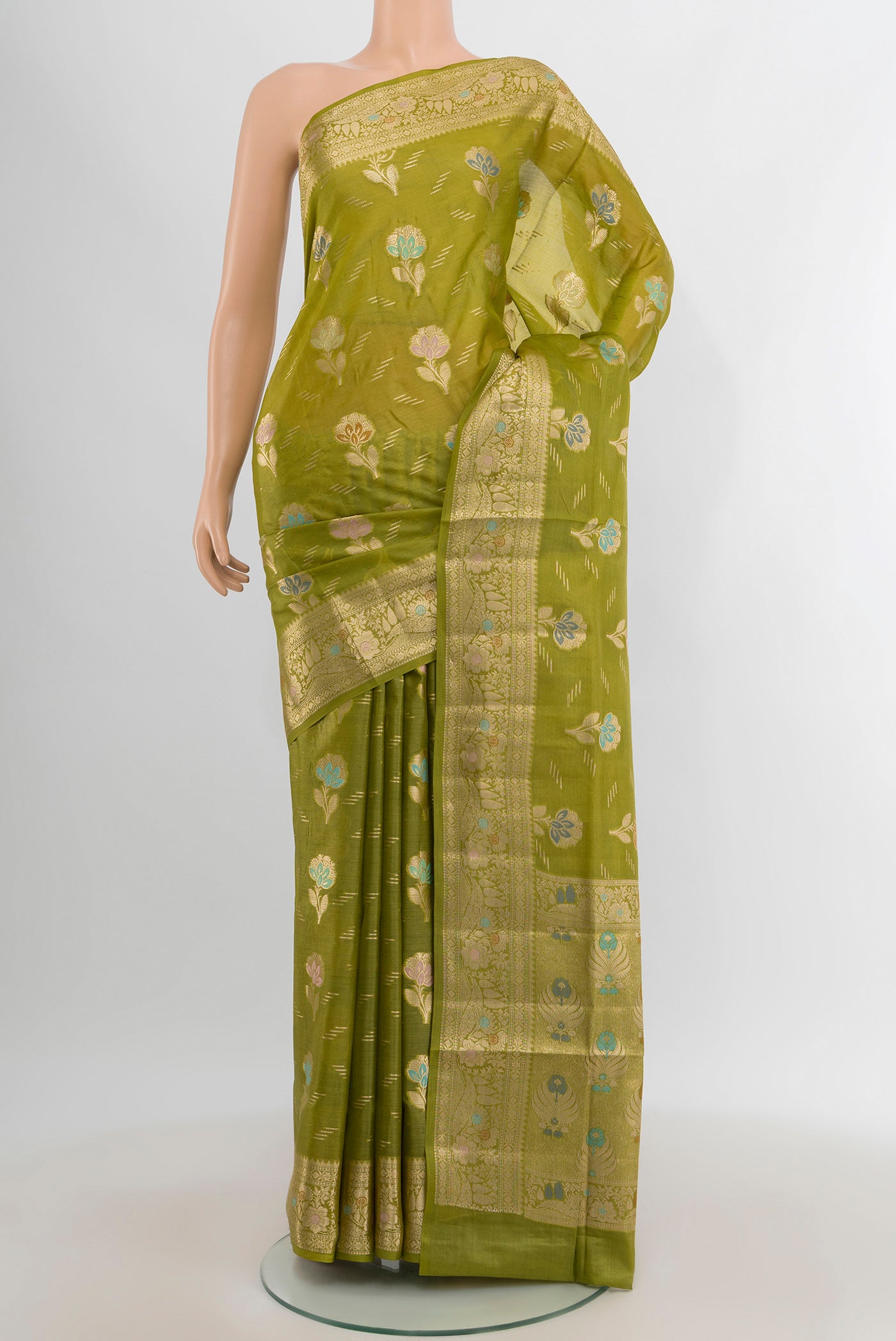 Light Green Banarasi Tussar Silk Saree with Zari Butta on the body and Zari Border.  displayed on a mannequin
