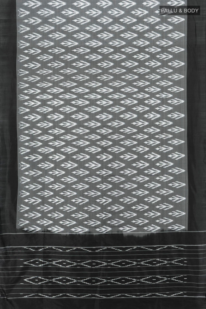 Flat view of Black Pochampally Saree with Zari Butta on the body and Silk Border. 