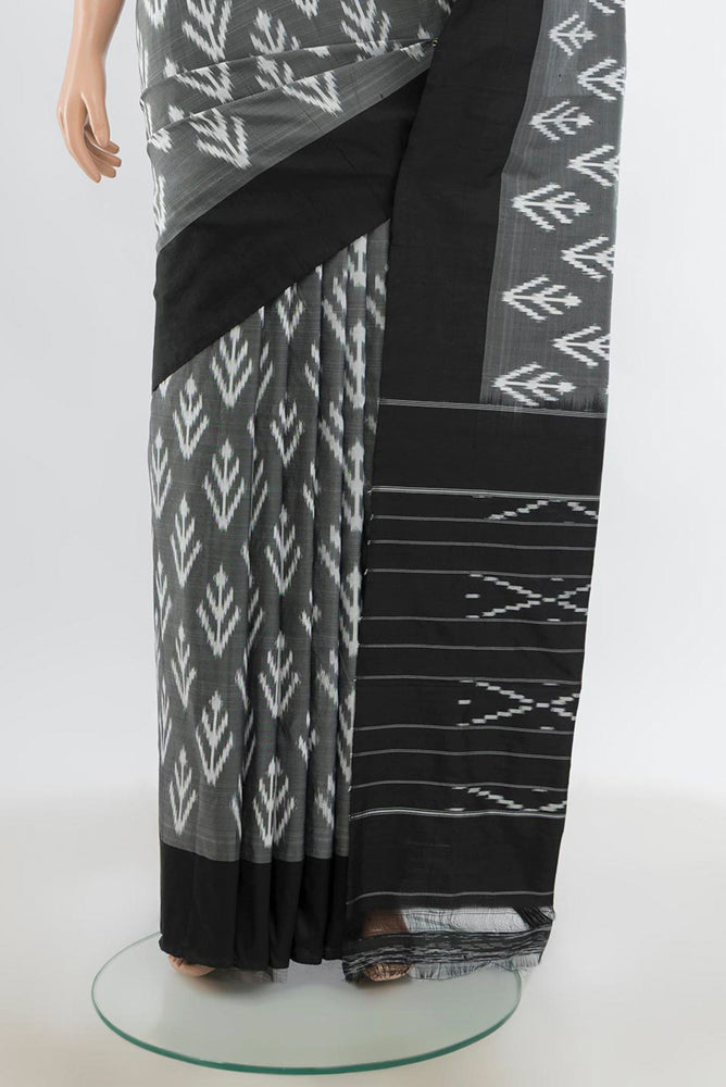 Pleats and pallu of Black Pochampally Saree with Zari Butta on the body and Silk Border. 