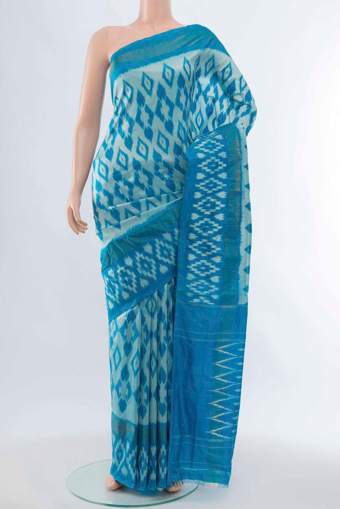 Light Blue Pochampally Saree with Zari Butta on the body and Zari Border displayed on a mannequin