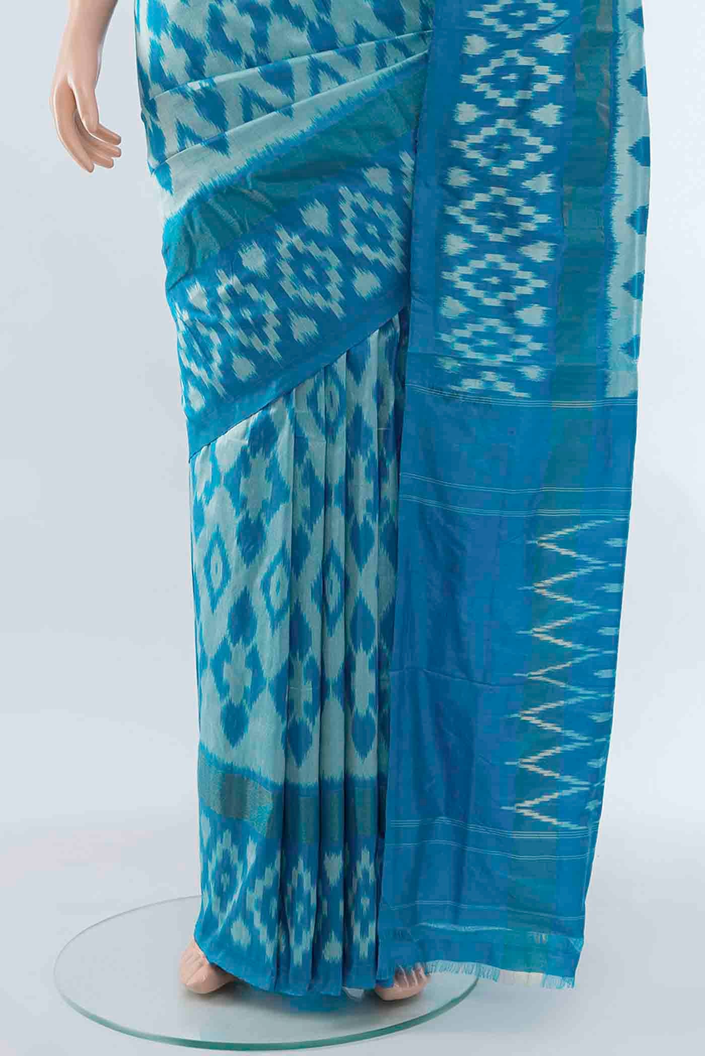 Pleats and pallu of Light Blue Pochampally Saree with Zari Butta on the body and Zari Border