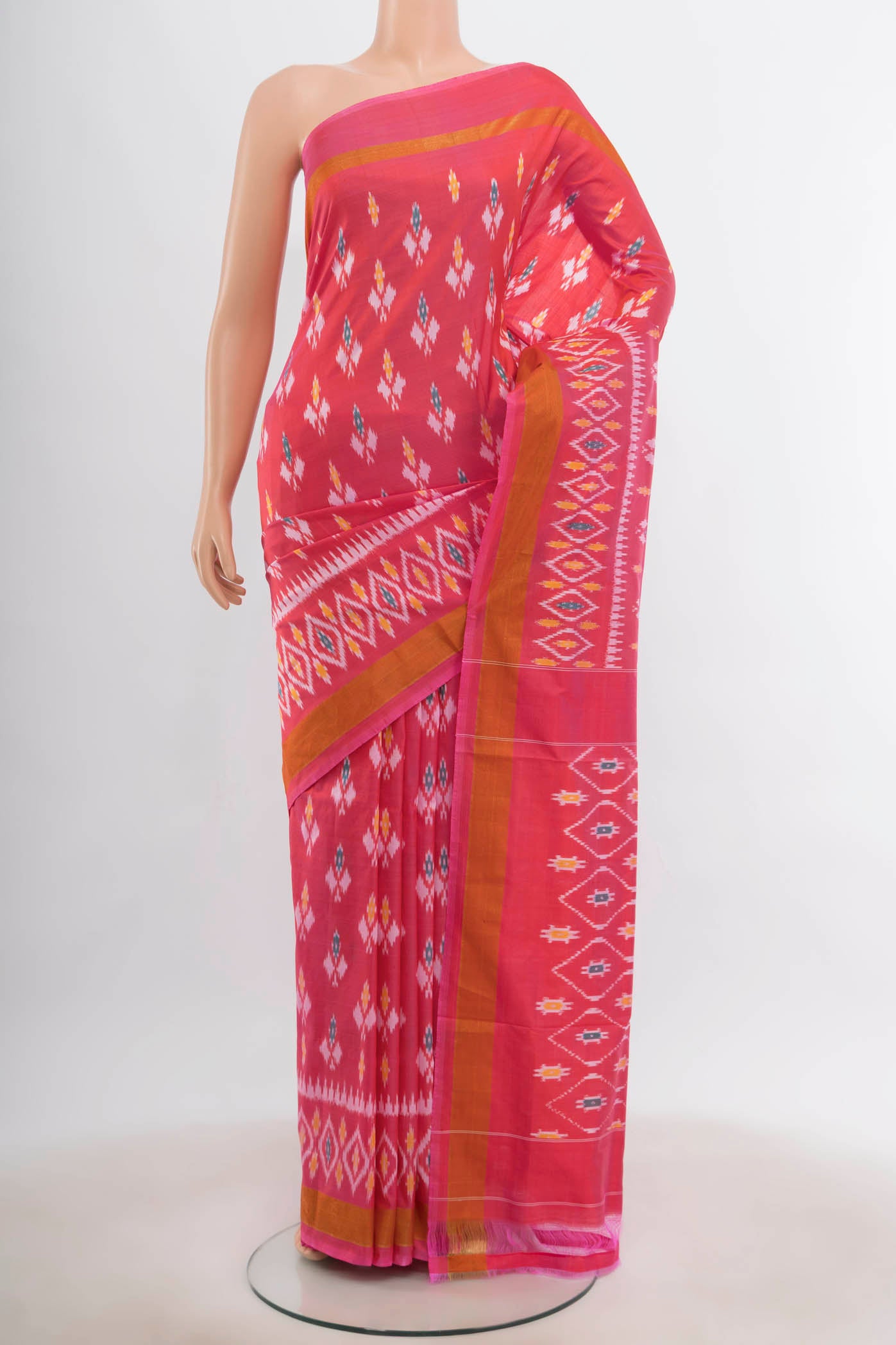 Rose pink Pochampally Saree with Ikat Print on the body and Silk Border.  displayed on a mannequin