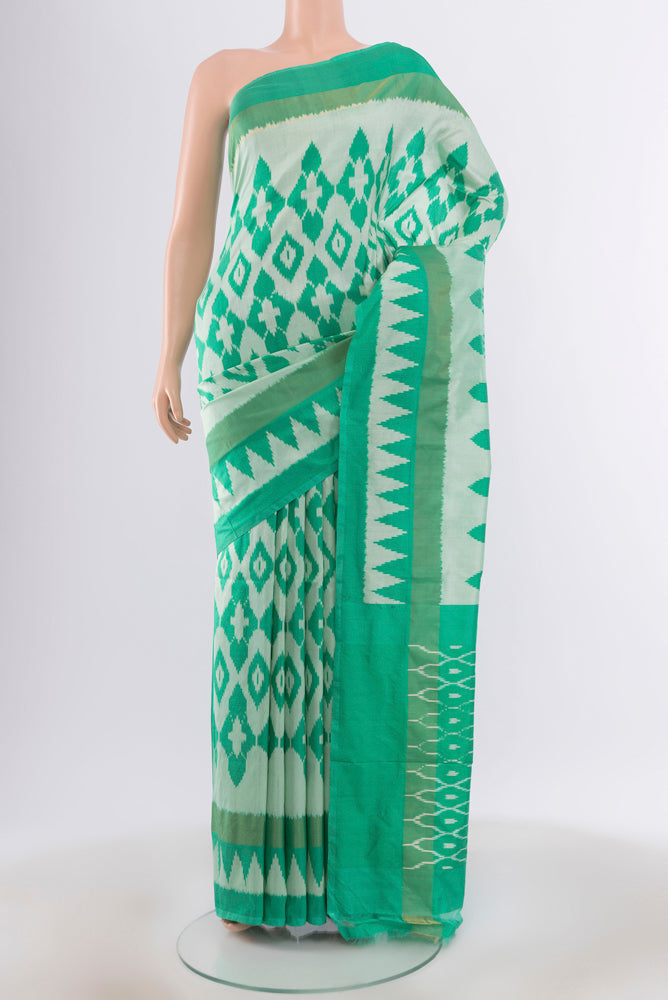 Sky Blue Pochampally Saree with Ikat design on the body and Silk Border.  displayed on a mannequin