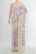 Off White Pochampally Silk Saree with Pure Ikat on the body and Plain Border.  displayed on a mannequin