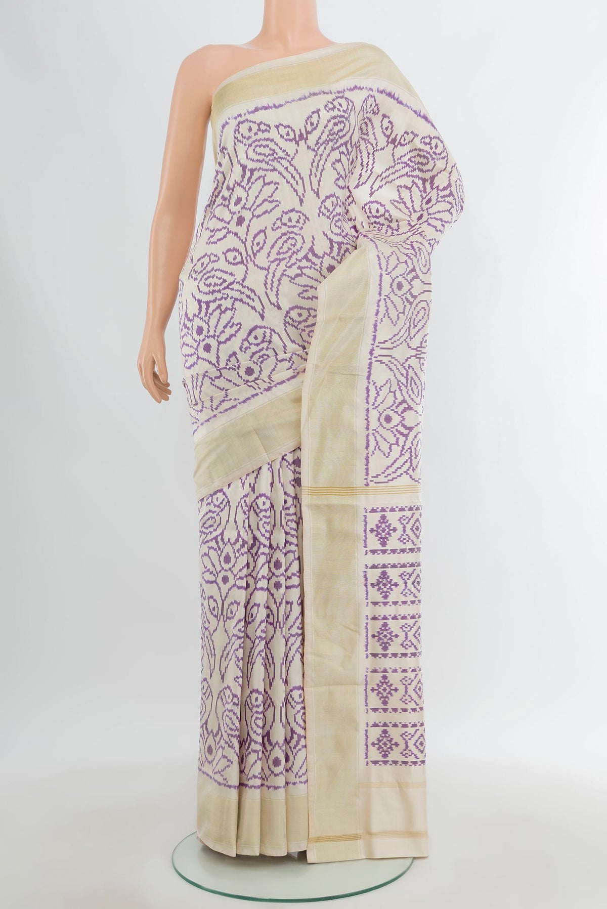 Off White Pochampally Silk Saree with Pure Ikat on the body and Plain Border.  displayed on a mannequin