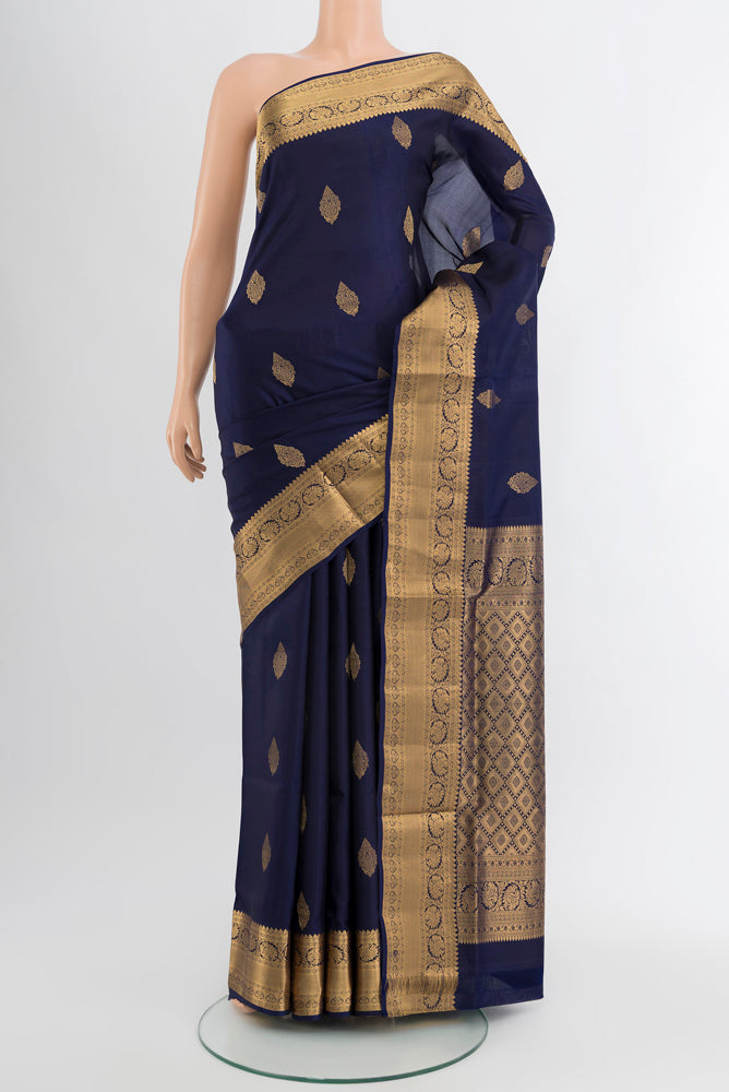 Navy Blue Soft Silk Saree with Zari Butta on the body and Silk Border.  displayed on a mannequin