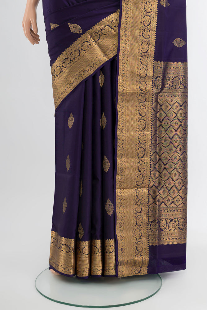 Pleats and pallu of Navy Blue Soft Silk Saree with Zari Butta on the body and Silk Border. 