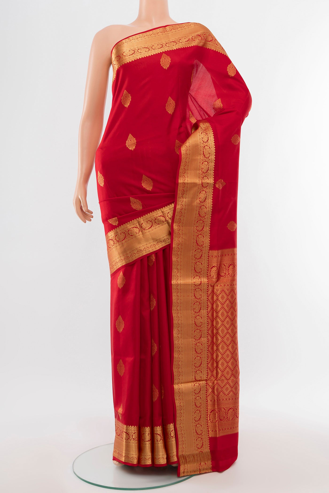 Red Soft Silk Saree with Zari Butta on the body and Silk Border.  displayed on a mannequin