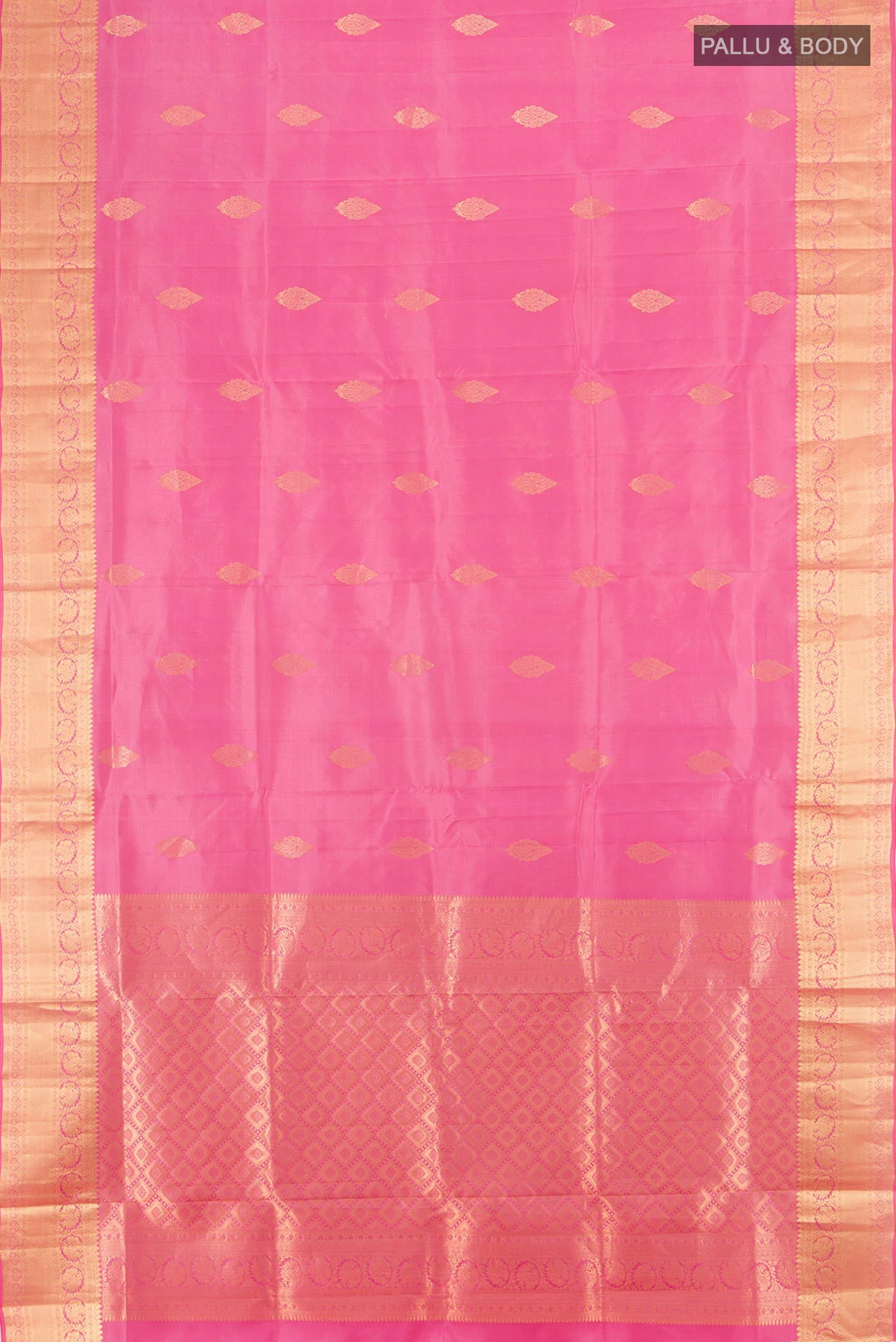 Flat view of Rose Gold Soft Silk Saree with Zari Butta on the body and Silk Border. 
