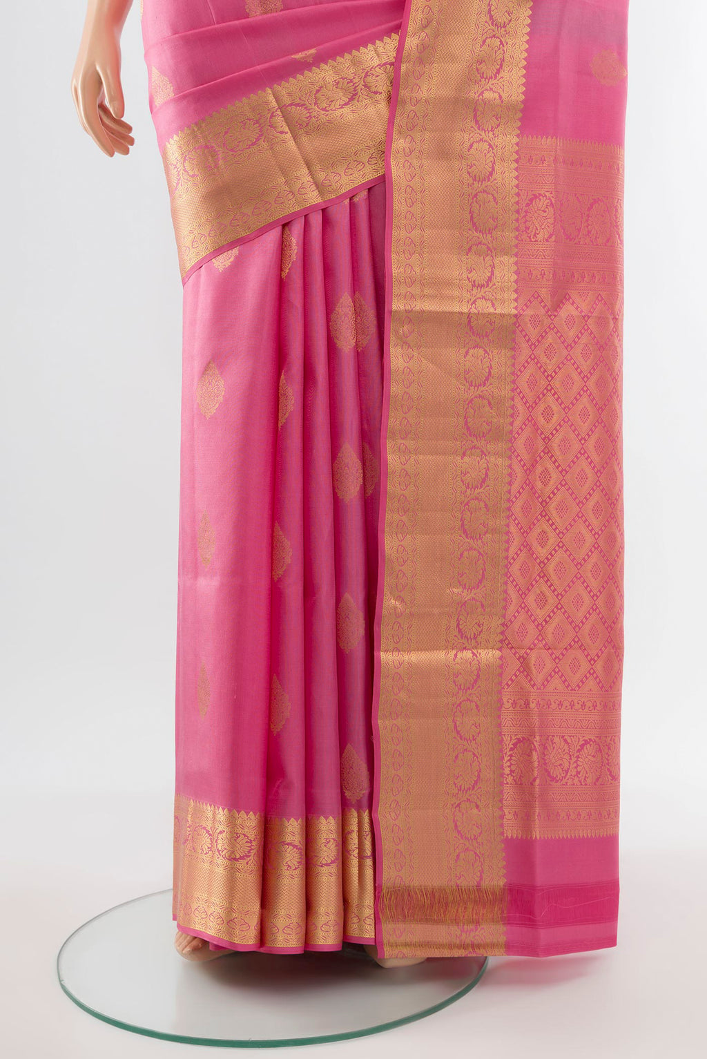 Pleats and pallu of Rose Gold Soft Silk Saree with Zari Butta on the body and Silk Border. 