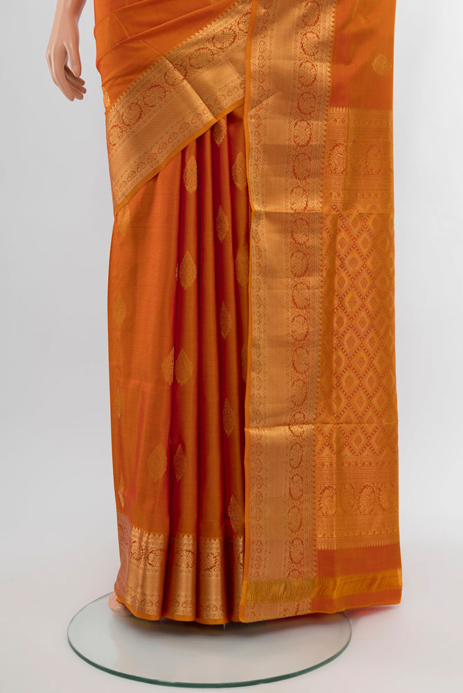 Pleats and pallu of Mustard Soft Silk Saree with Zari Butta on the body and Silk Border. 
