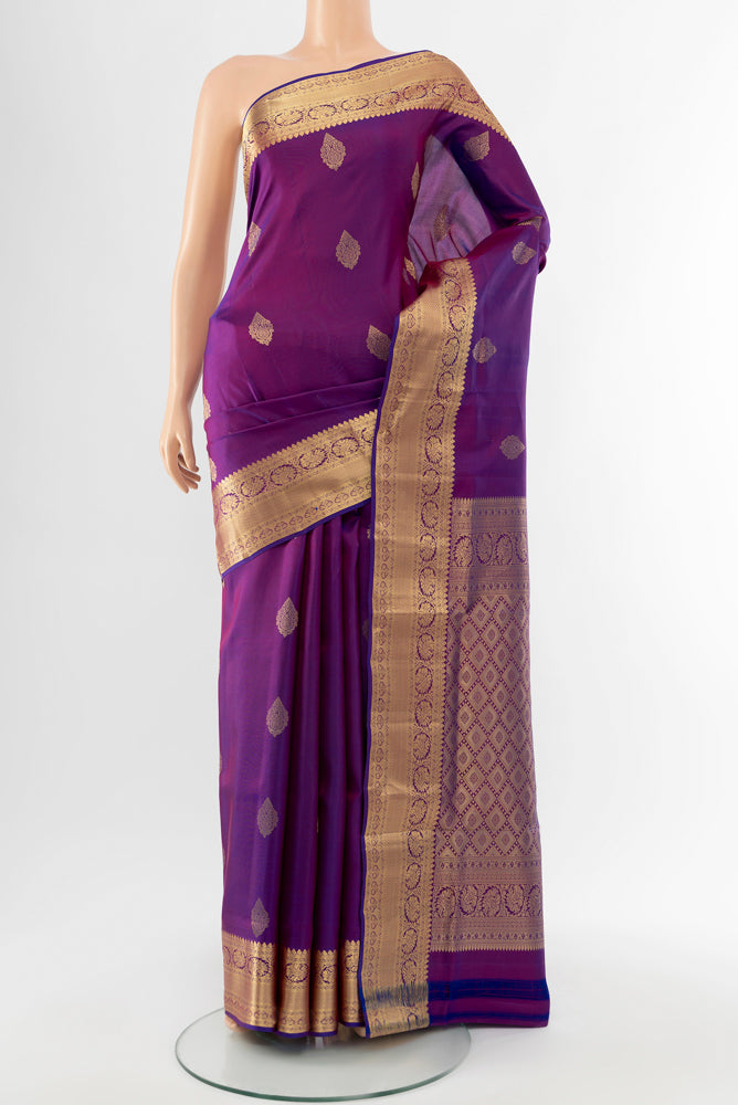 Purple Soft Silk Saree with Zari Butta on the body and Silk Border.  displayed on a mannequin