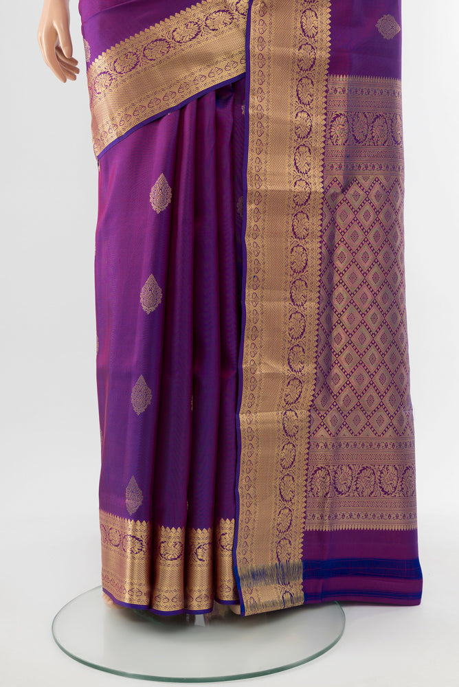 Pleats and pallu of Purple Soft Silk Saree with Zari Butta on the body and Silk Border. 