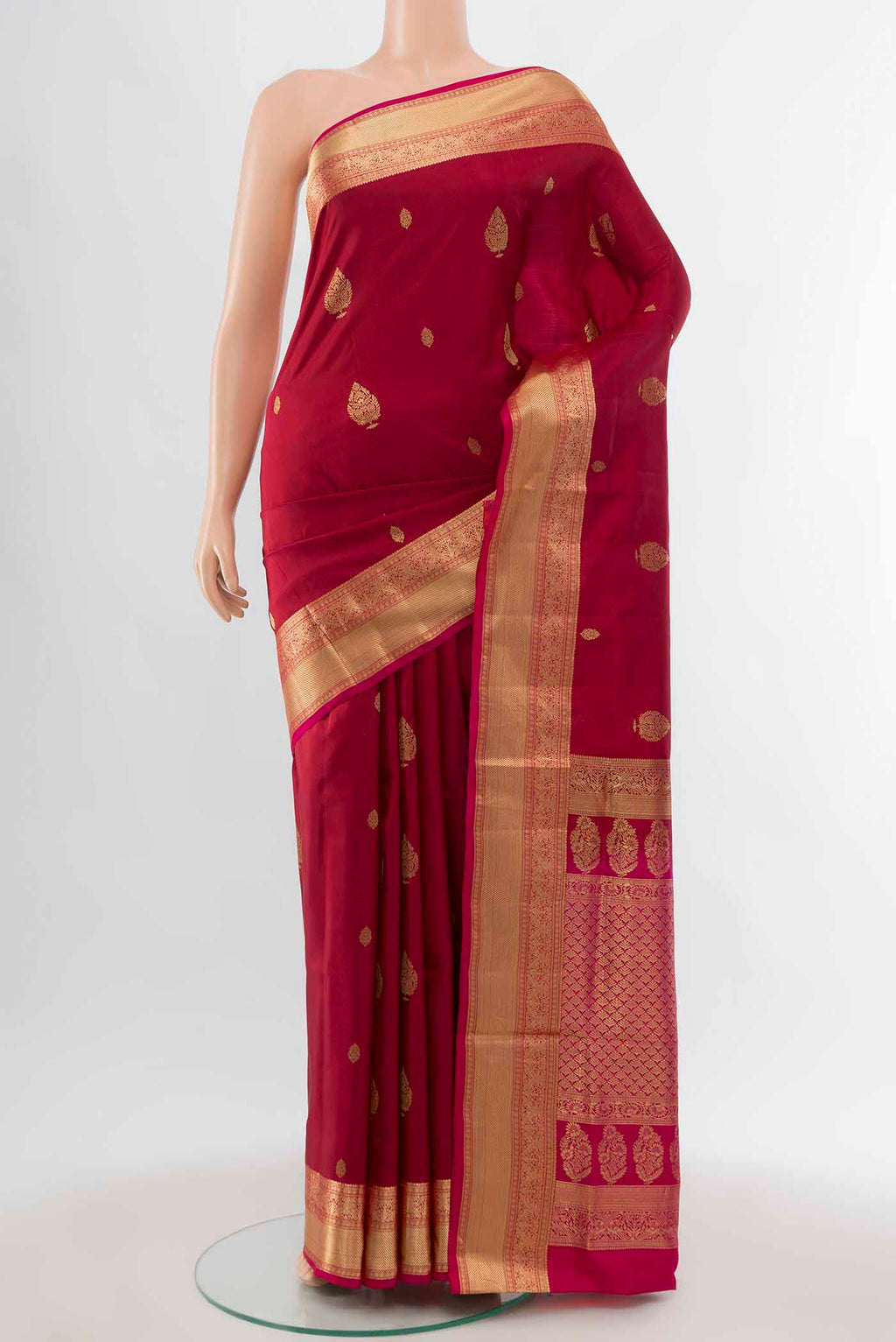 Maroon Soft Silk Saree with Zari Butta on the body and Silk Border displayed on a mannequin