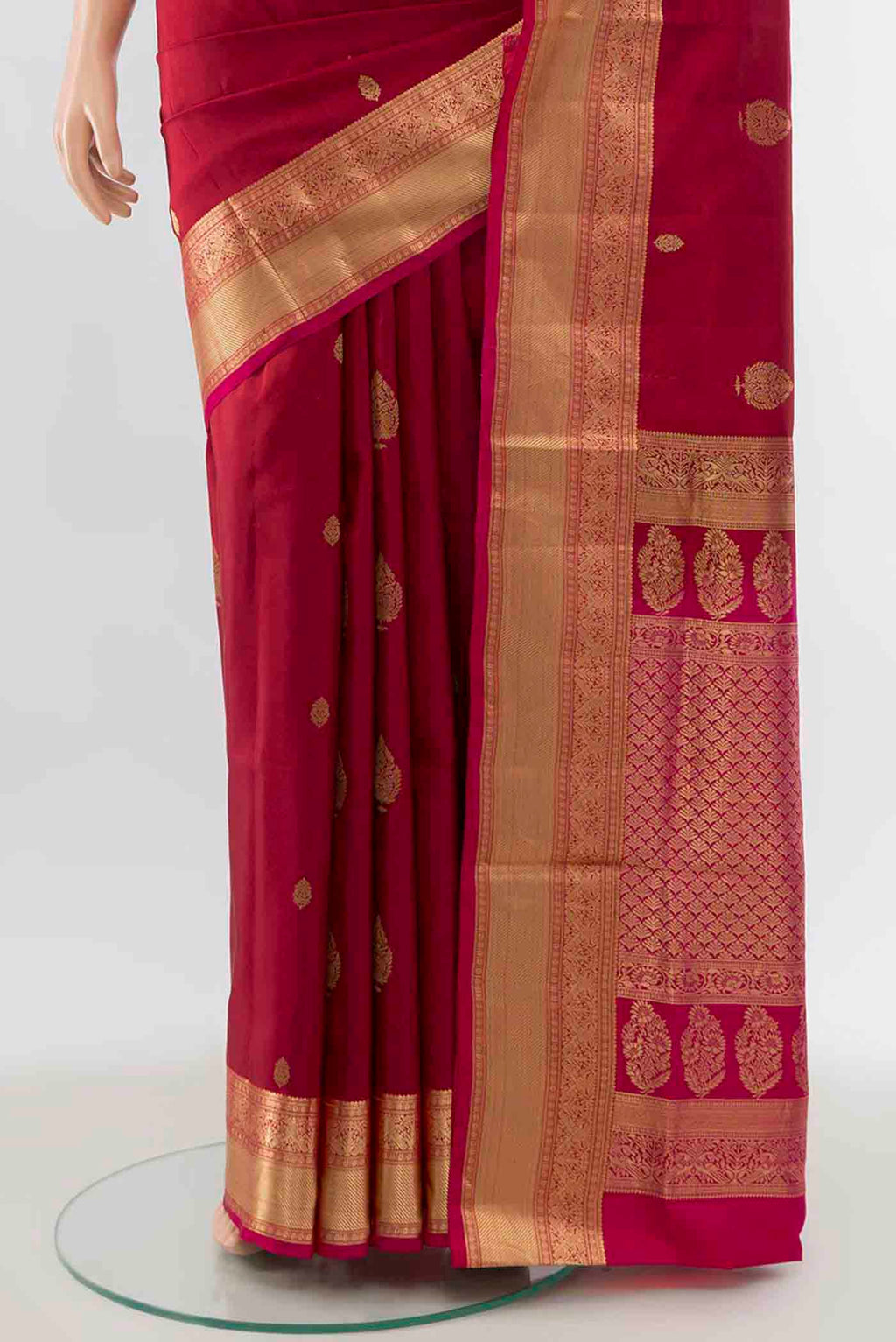 Pleats and pallu of Maroon Soft Silk Saree with Zari Butta on the body and Silk Border