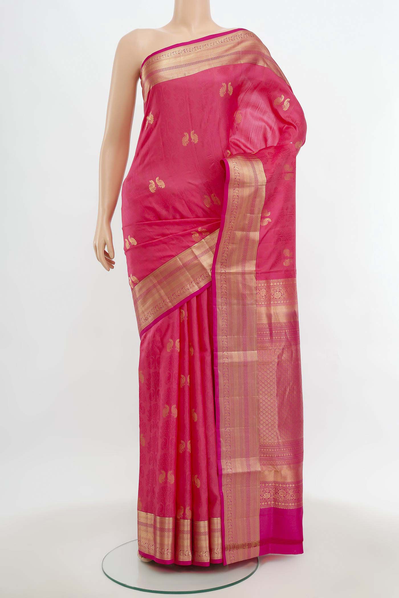 Rose pink Soft Silk Saree with Zari Butta on the body and Silk Border.  displayed on a mannequin