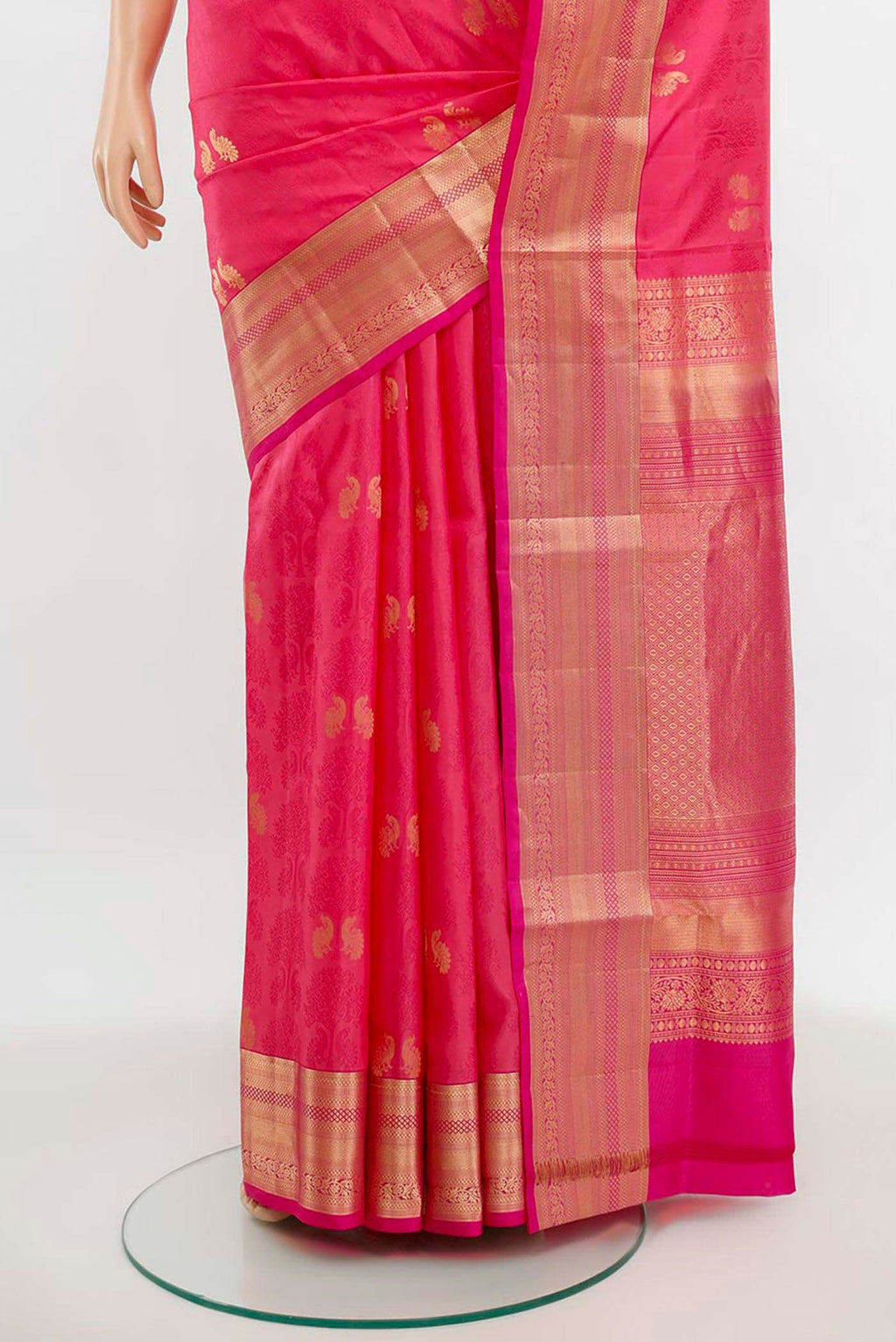 Pleats and pallu of Rose pink Soft Silk Saree with Zari Butta on the body and Silk Border. 