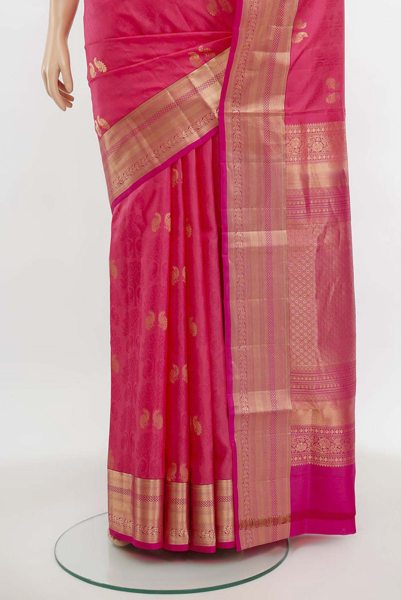 Pleats and pallu of Rose pink Soft Silk Saree with Zari Butta on the body and Silk Border. 