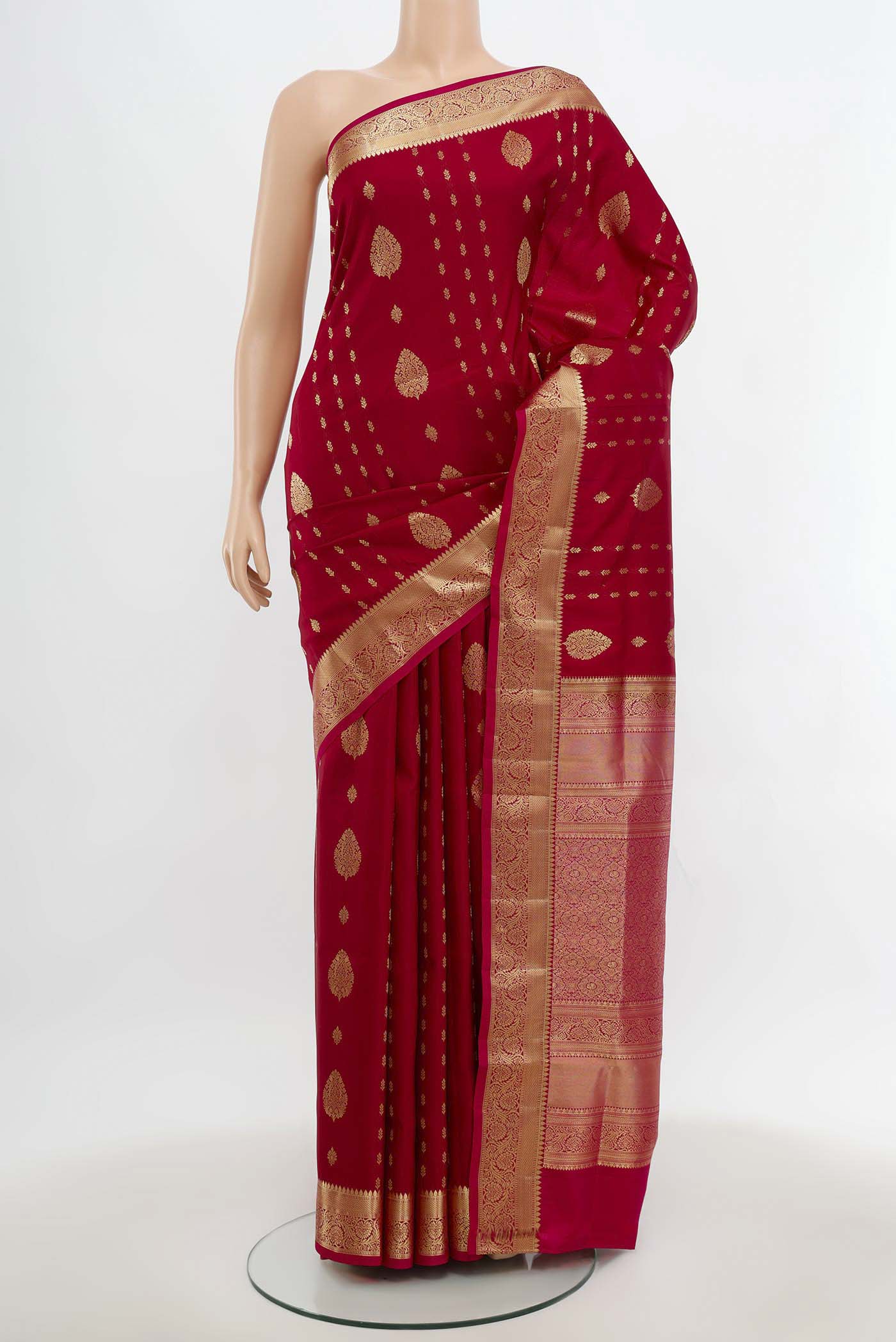 Maroon Soft Silk Saree with Zari Butta on the body and Silk Border.  displayed on a mannequin