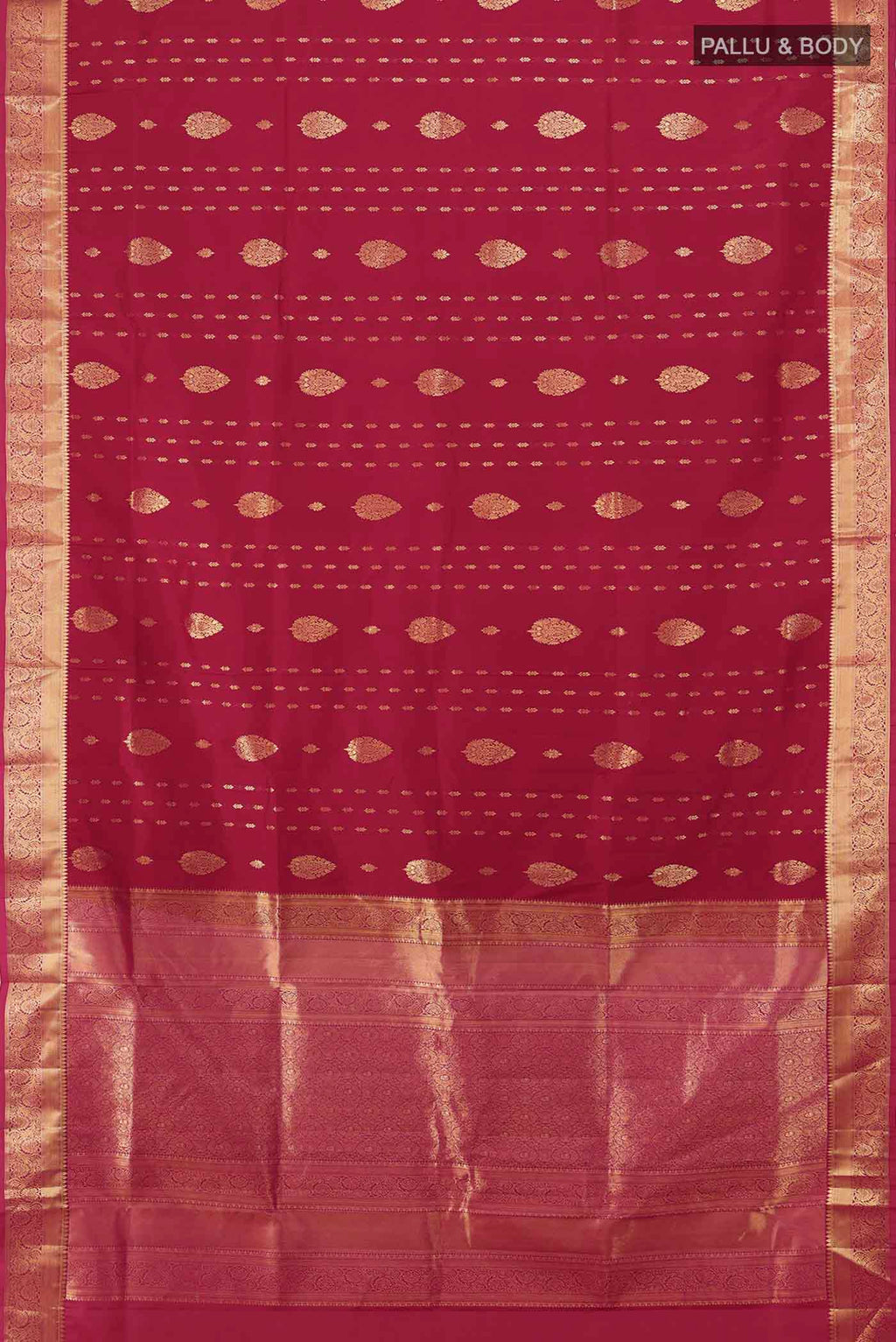 Flat view of Maroon Soft Silk Saree with Zari Butta on the body and Silk Border. 