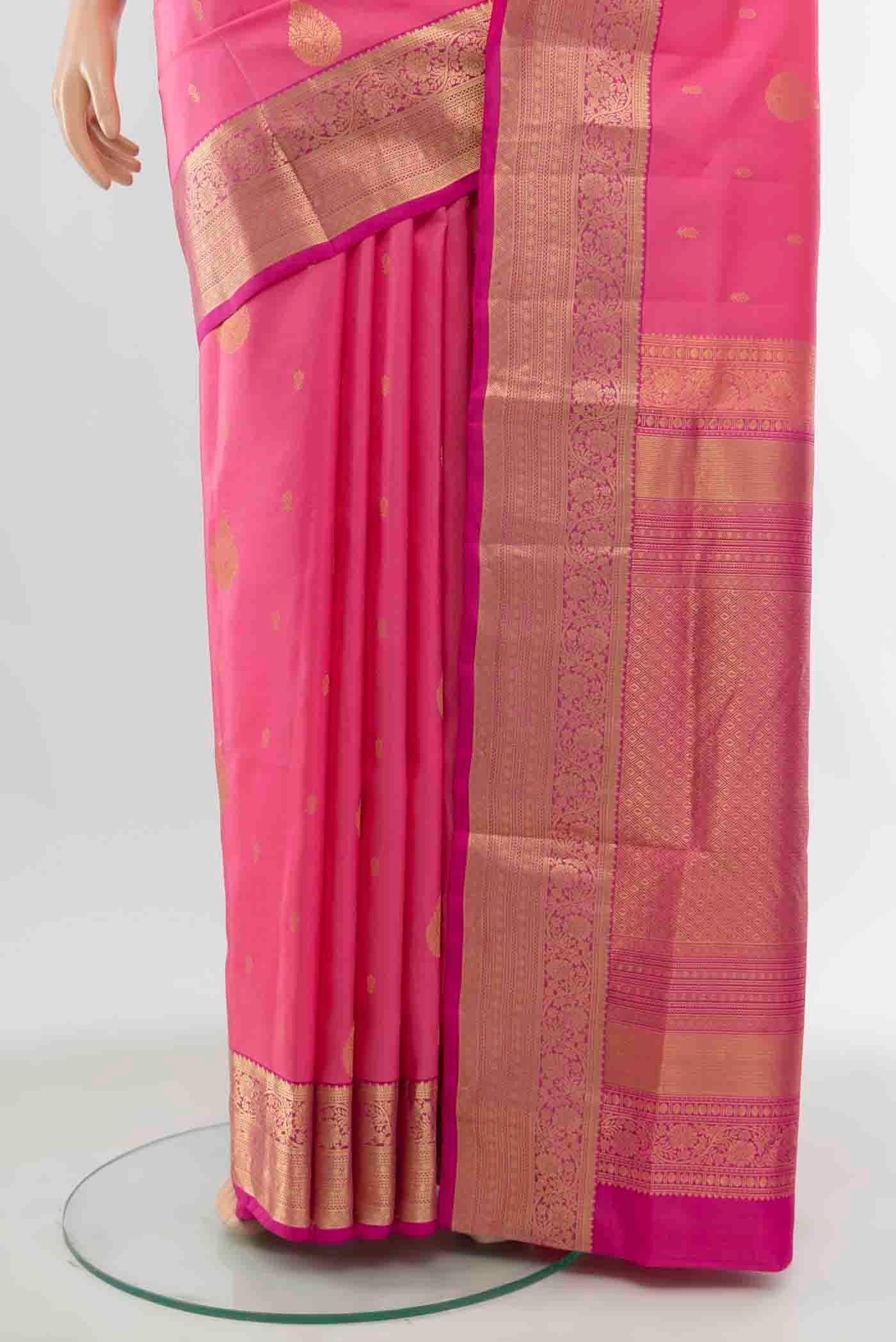 Pleats and pallu of Rose pink Soft Silk Saree with Zari Butta on the body and Zari Border