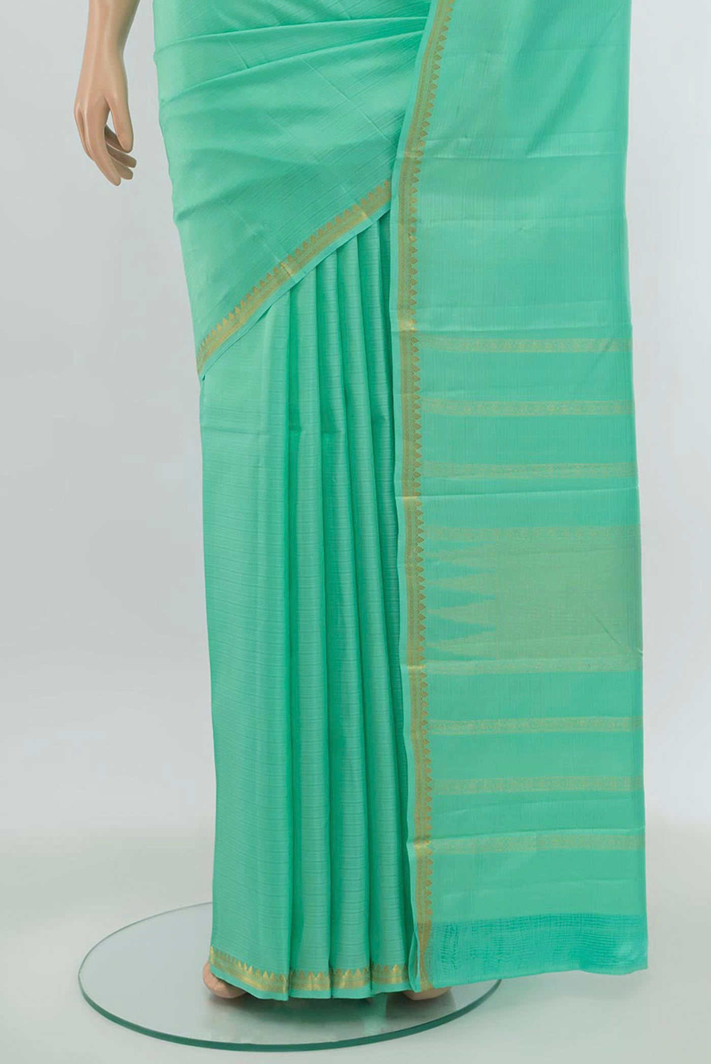 Pleats and pallu of Sage Green Soft Silk Saree with Zari Butta on the body and Silk Border. 