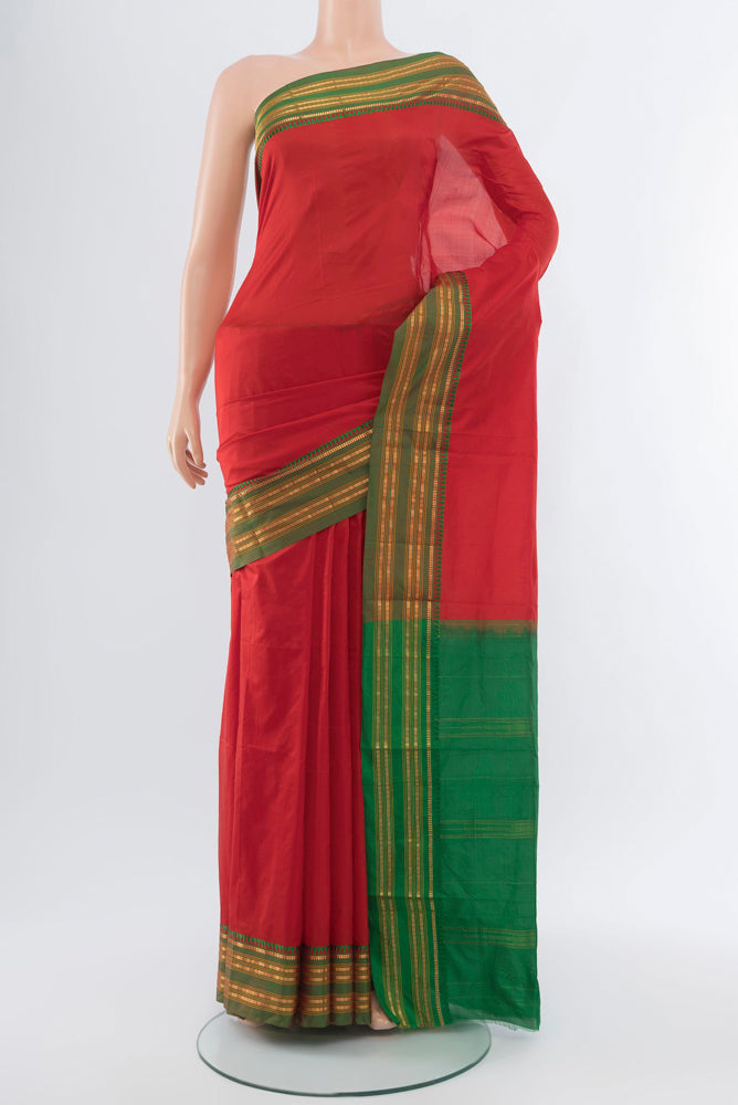 Red Narayanpet Silk Saree with Plain Body and Silk Border.  displayed on a mannequin