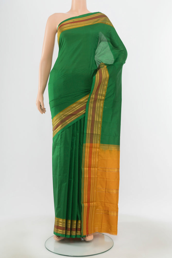 Pure Silk Pure Zari Mint Green Narayanpet Saree with Zari Butta on the body and Silk Border.  displayed on a mannequin