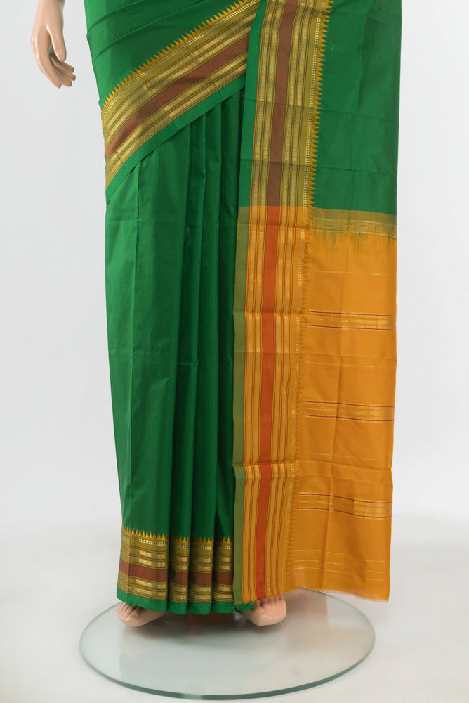 Pleats and pallu of Pure Silk Pure Zari Mint Green Narayanpet Saree with Zari Butta on the body and Silk Border. 