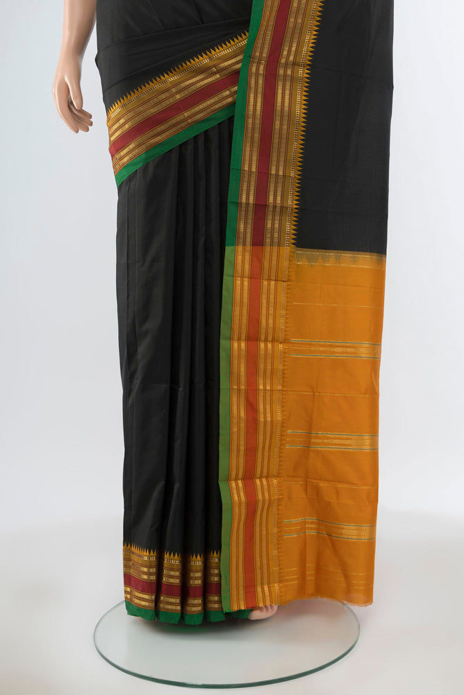 Pleats and pallu of Pure Silk Pure Zari Black Narayanpet Saree with Plain Body and Silk Border. 