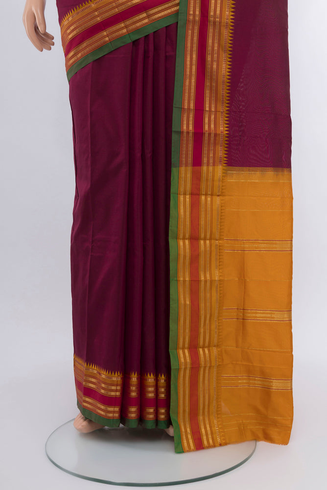 Pleats and pallu of Coffee Brown Rajkot Patola Silk Saree with Zari Butta on the body and Silk Border. 