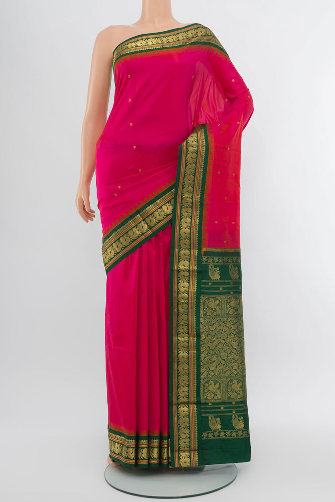 Peach Narayanpet Silk Saree with Zari Butta on the body and Silk Border.  displayed on a mannequin