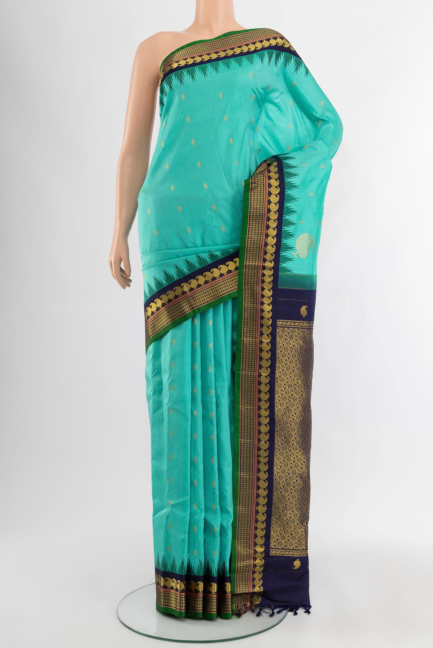 Light Blue Gadwal Silk Saree with Zari Butta on the body and Zari Border.  displayed on a mannequin