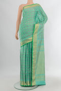Pure Silk Sea Green Gadwal Saree with Checked design on the body and Zari Border.  displayed on a mannequin
