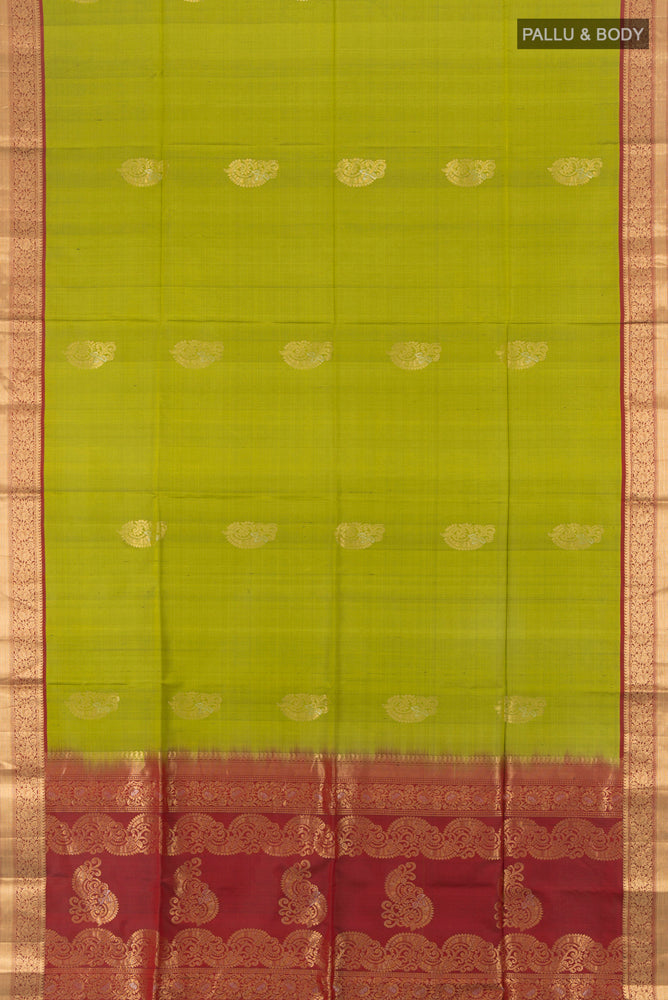 Flat view of Light Green Soft Silk Saree with Zari Butta on the body and Silk Border. 