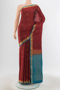 Pure Silk Pure Zari Maroon Soft Saree with Zari Butta on the body and Silk Border.  displayed on a mannequin