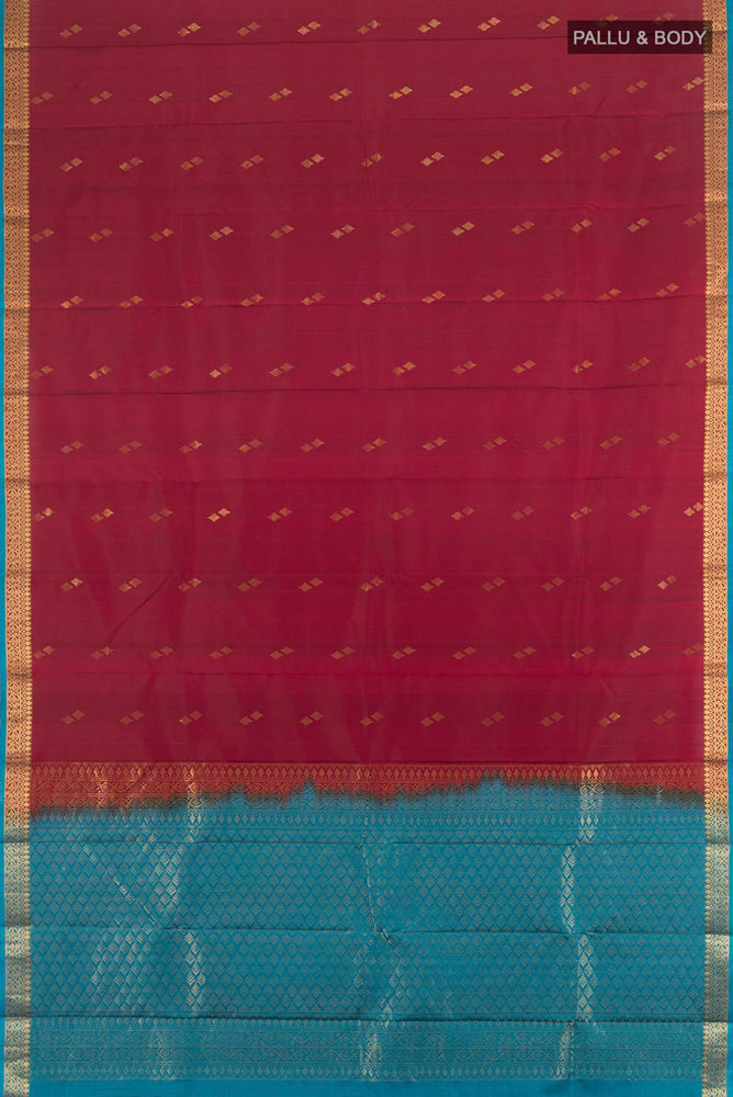 Flat view of Pure Silk Pure Zari Maroon Soft Saree with Zari Butta on the body and Silk Border. 