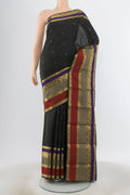 Black Kanjivaram Silk Saree with Zari Butta on the body and Silk Border.  displayed on a mannequin