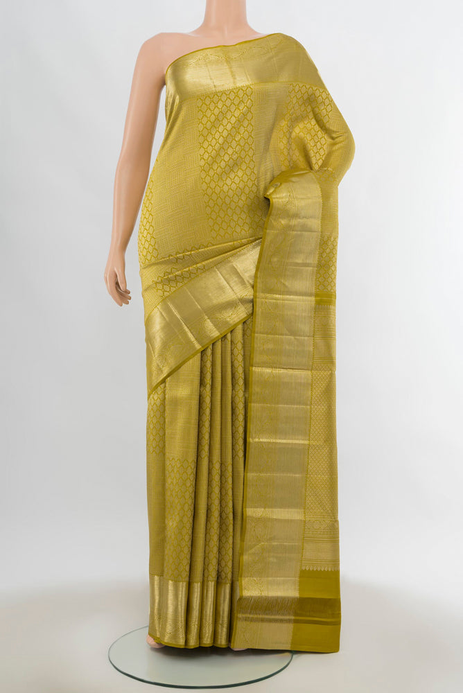 Pure Silk Pure Zari Mehandi Green Kanchipuram Saree with Zari Butta on the body and Silk Border.  displayed on a mannequin