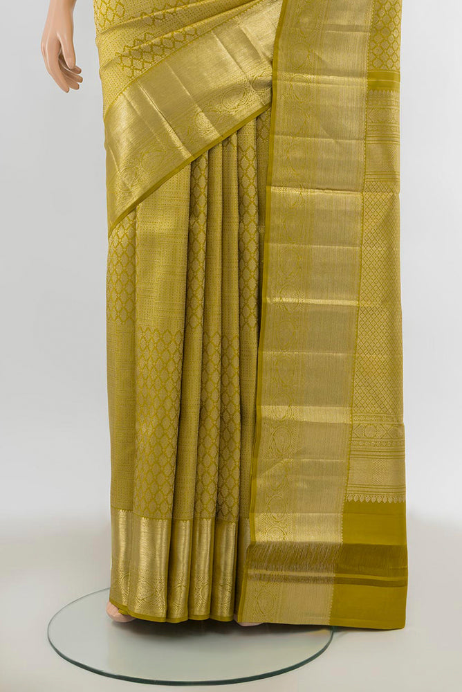 Pleats and pallu of Pure Silk Pure Zari Mehandi Green Kanchipuram Saree with Zari Butta on the body and Silk Border. 