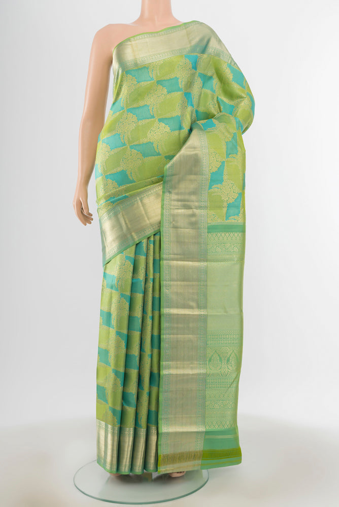 Multi Color Kanjivaram Silk Saree with Zari Butta on the body and Silk Border.  displayed on a mannequin